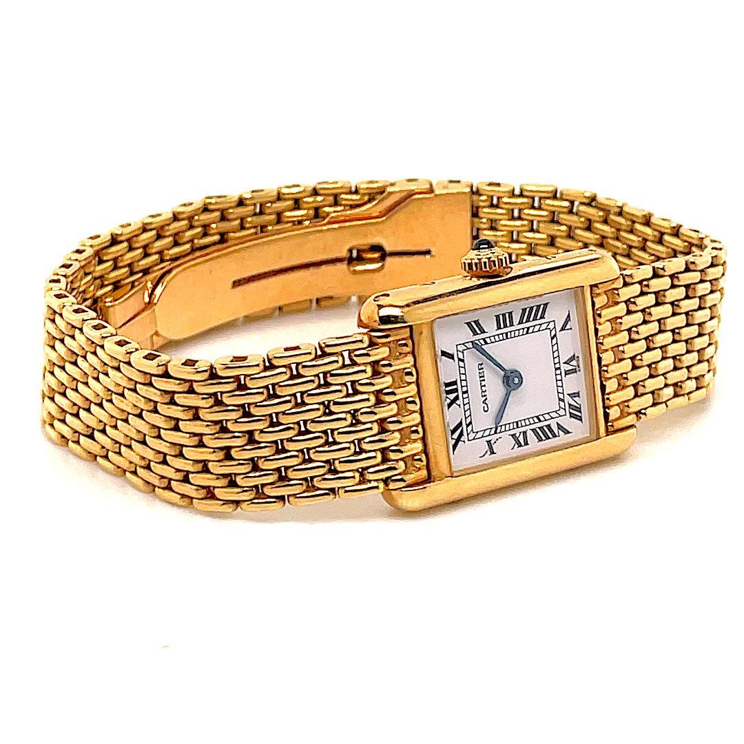 CARTIER Tank Louis Yellow gold bracelet watch. White lac…